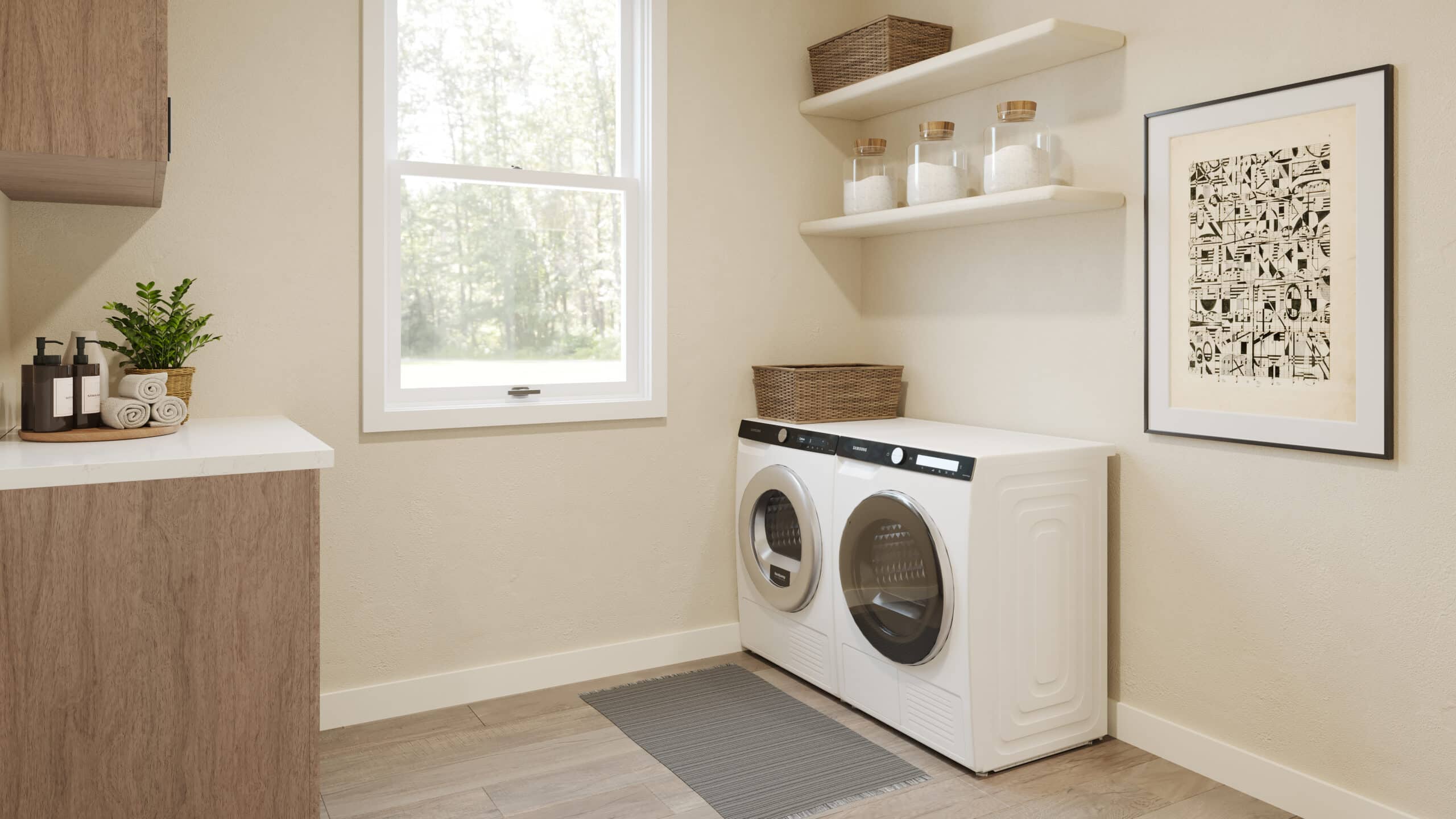 Laundry room with stacked front-loading washer and dryer under open shelves holding glass jars and woven baskets, a window, countertop with plant and towels, and framed artwork on the wall.