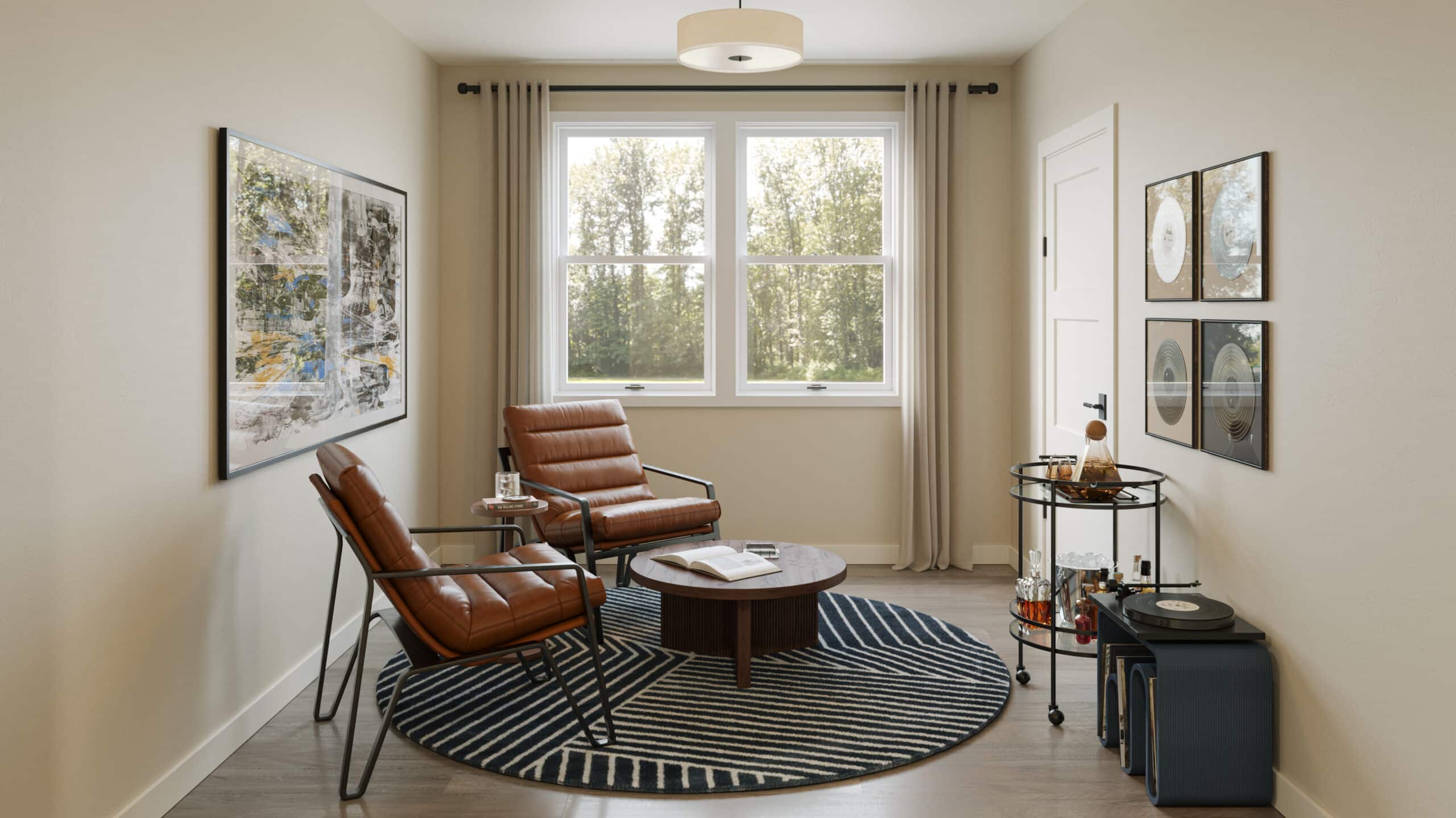 Small sitting room with two brown leather armchairs, round wooden coffee table on striped rug and drinks cart by window.