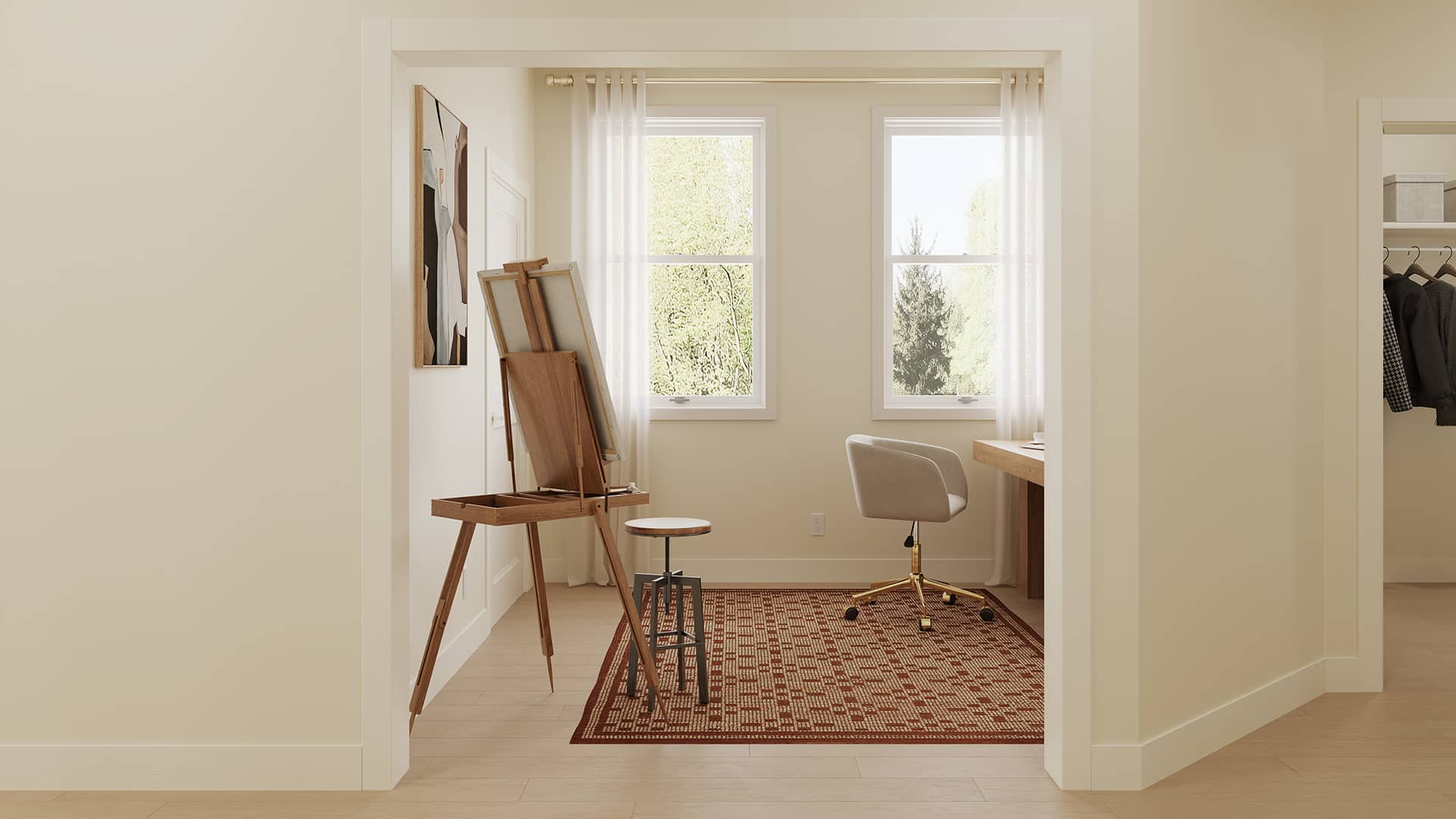 Home office with an easel, desk, office chair, patterned rug, clothing rack, and two sunlit windows