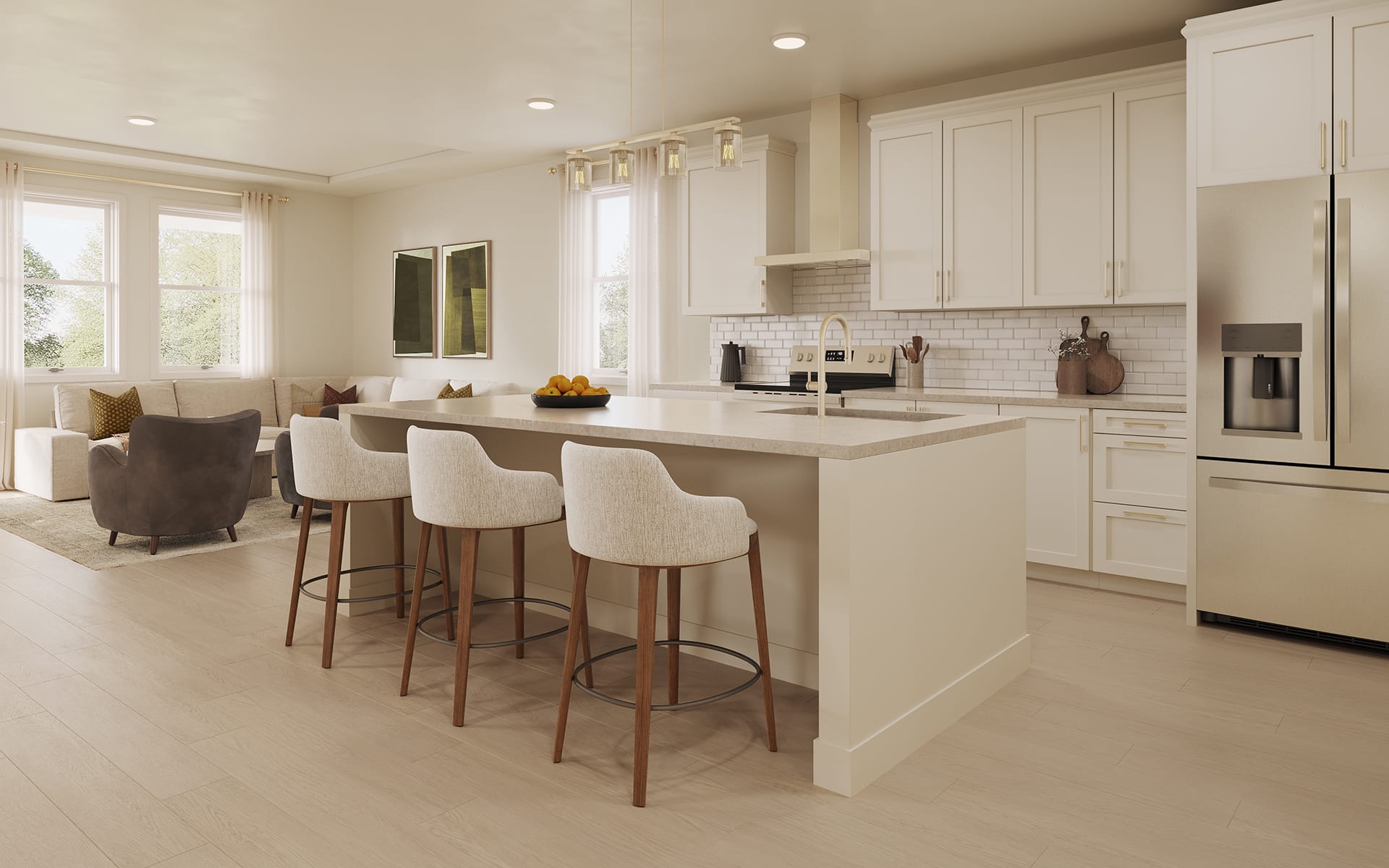 Bright open-plan kitchen and living room with a large island, three bar stools, white cabinetry, and stainless-steel appliances