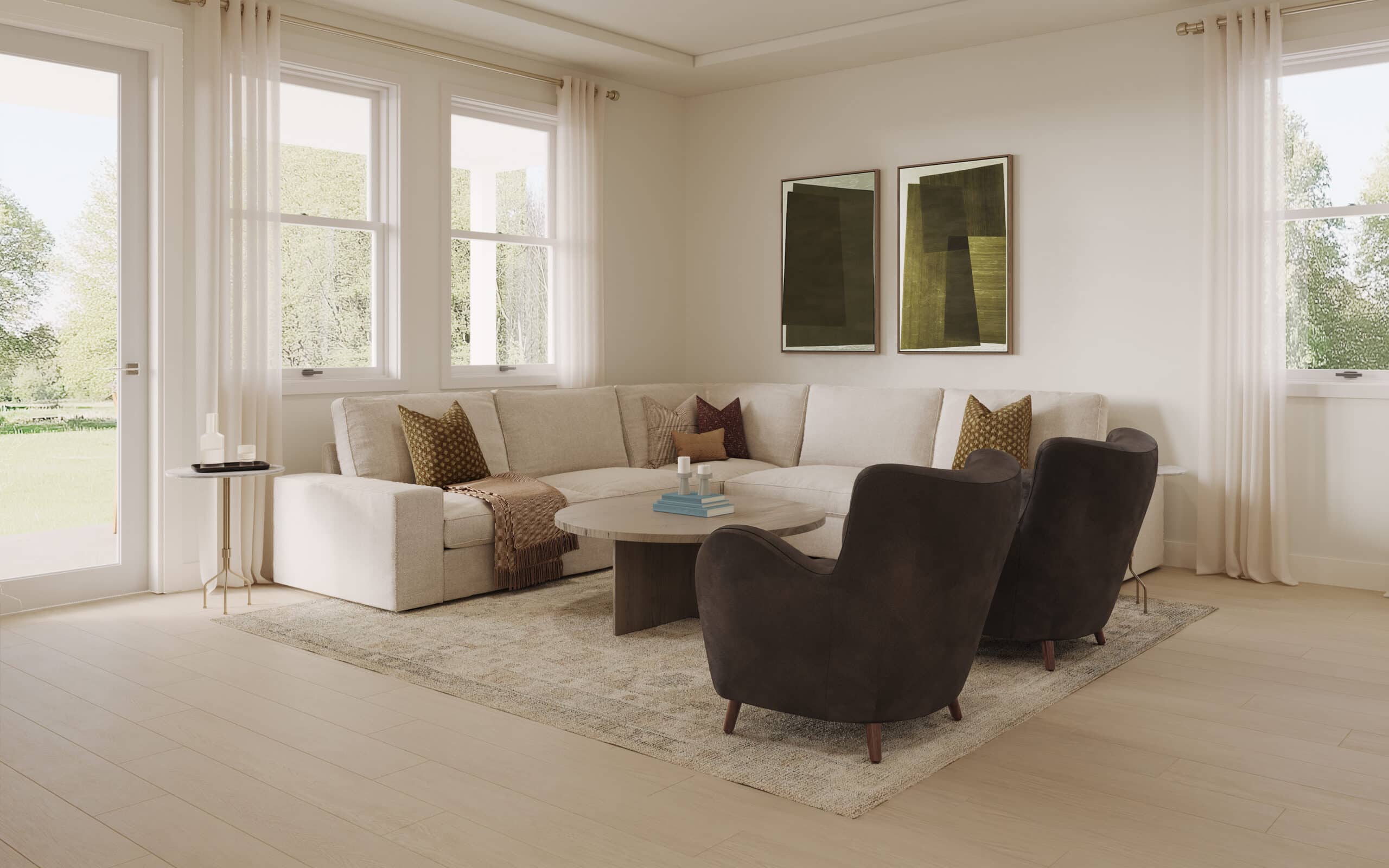 Bright living room with a sectional sofa, two dark armchairs, round coffee table, abstract artwork, and large windows overlooking greenery