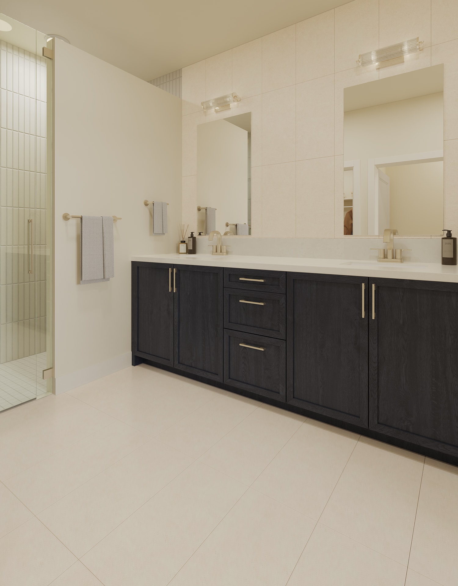 Modern bathroom with a double vanity, dark wood cabinetry, large mirrors, wall sconces, and a glass-enclosed shower