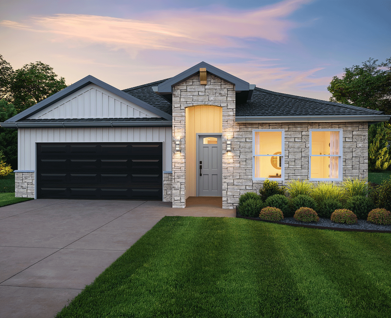 Single-story stone-front house with a two-car garage, lit entryway, landscaped garden, and green lawn at dusk