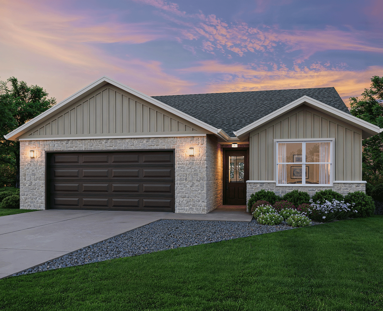 Single-story suburban house with stone facade, attached two-car garage, landscaped flower beds, and a lawn at sunset