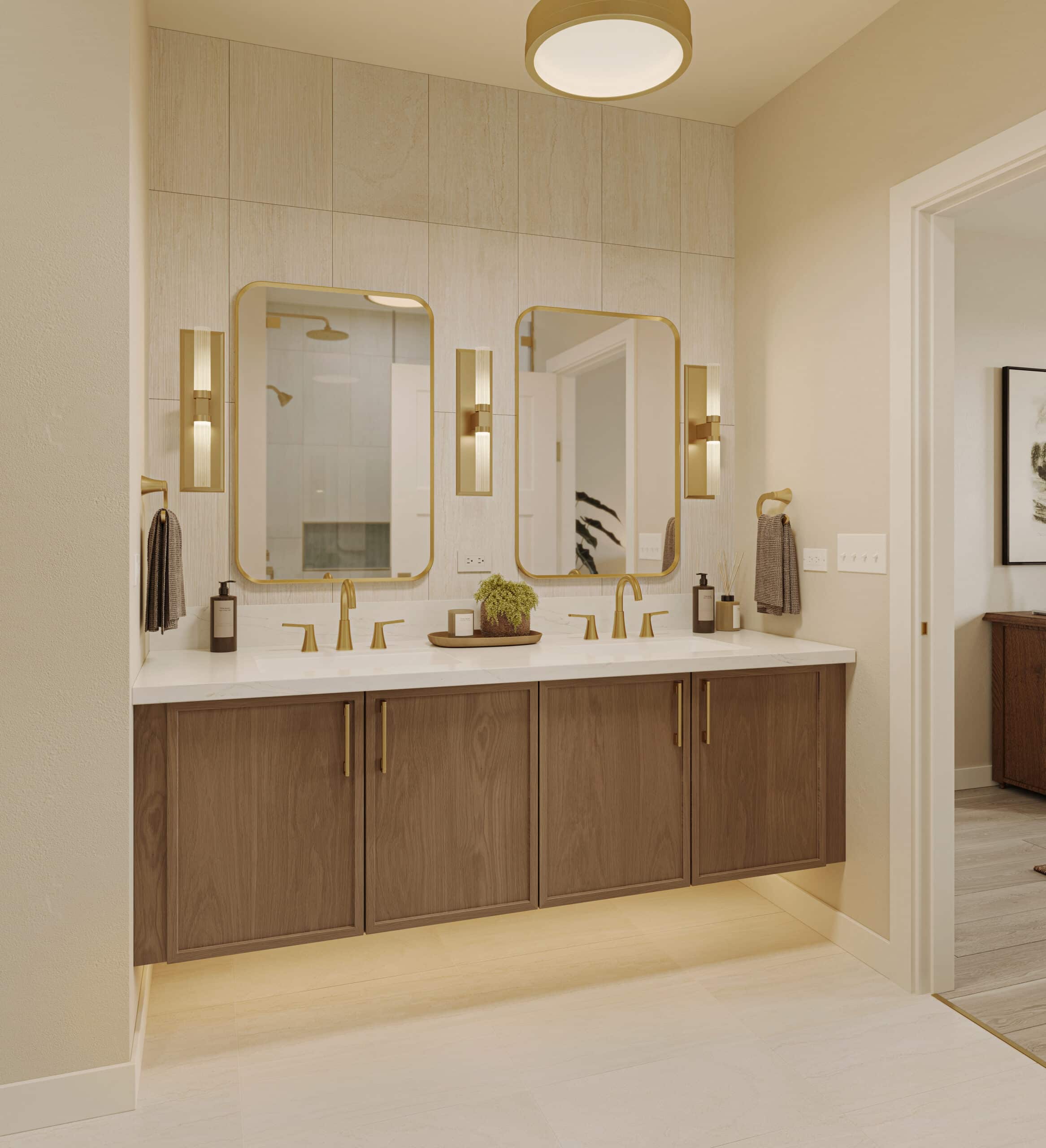 Modern bathroom vanity with double sinks, wood cabinetry, gold fixtures, two mirrors, and wall sconces