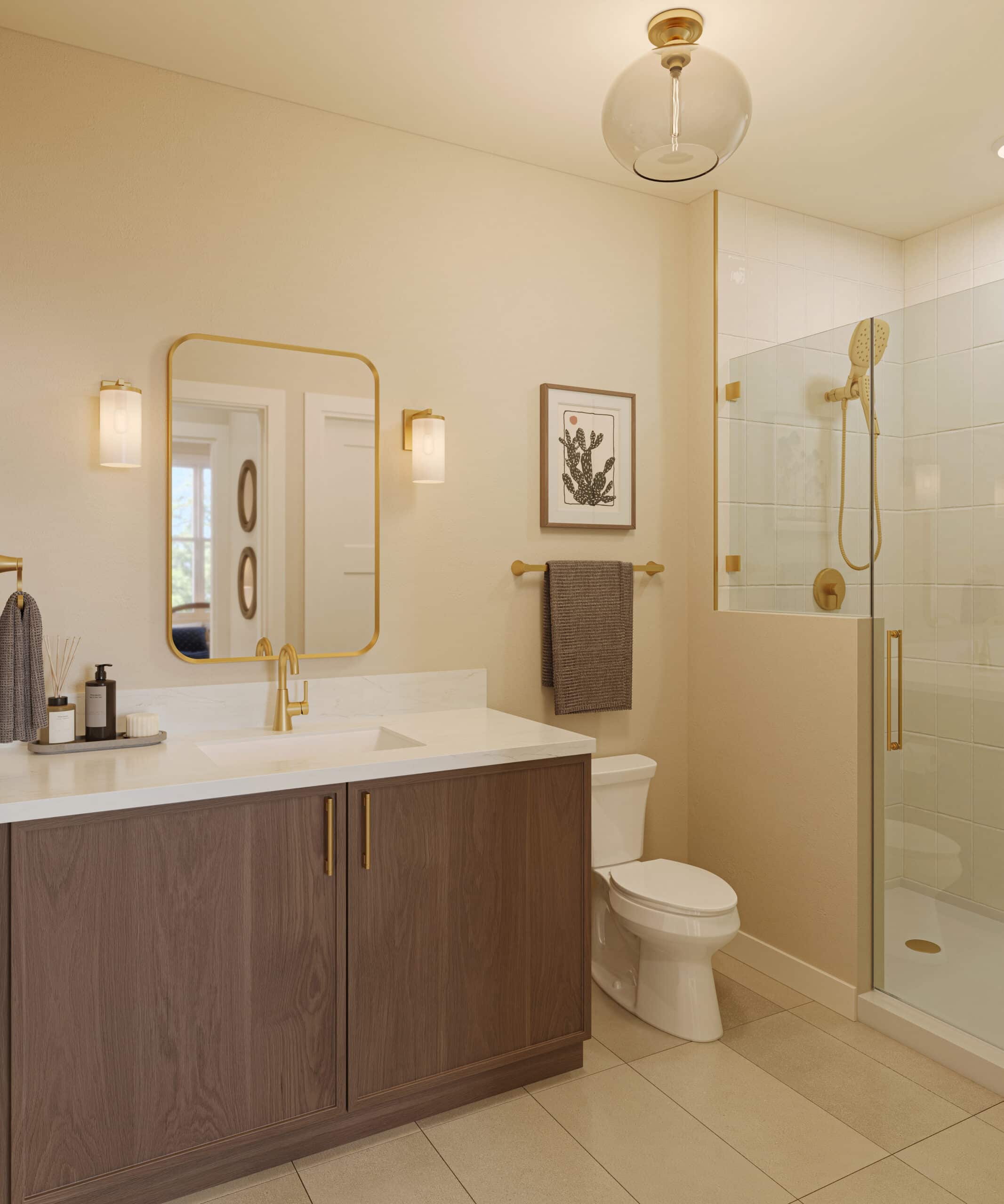 Modern bathroom with a wood vanity, gold-framed mirror and fixtures, toilet, and glass-enclosed tiled shower