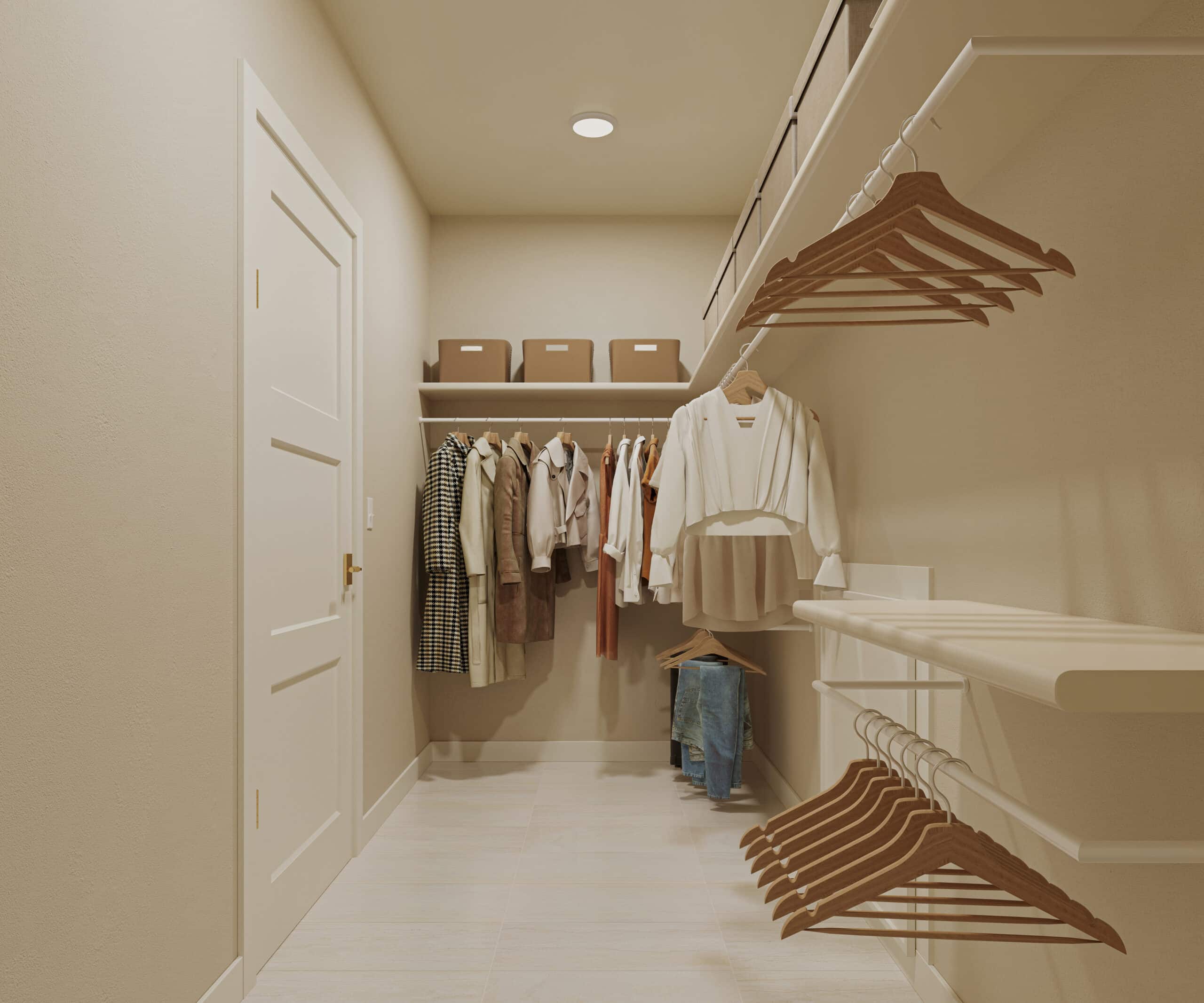 Walk-in closet with clothing, wooden hangers, shelves, storage boxes, and a white garment hanging in the foreground