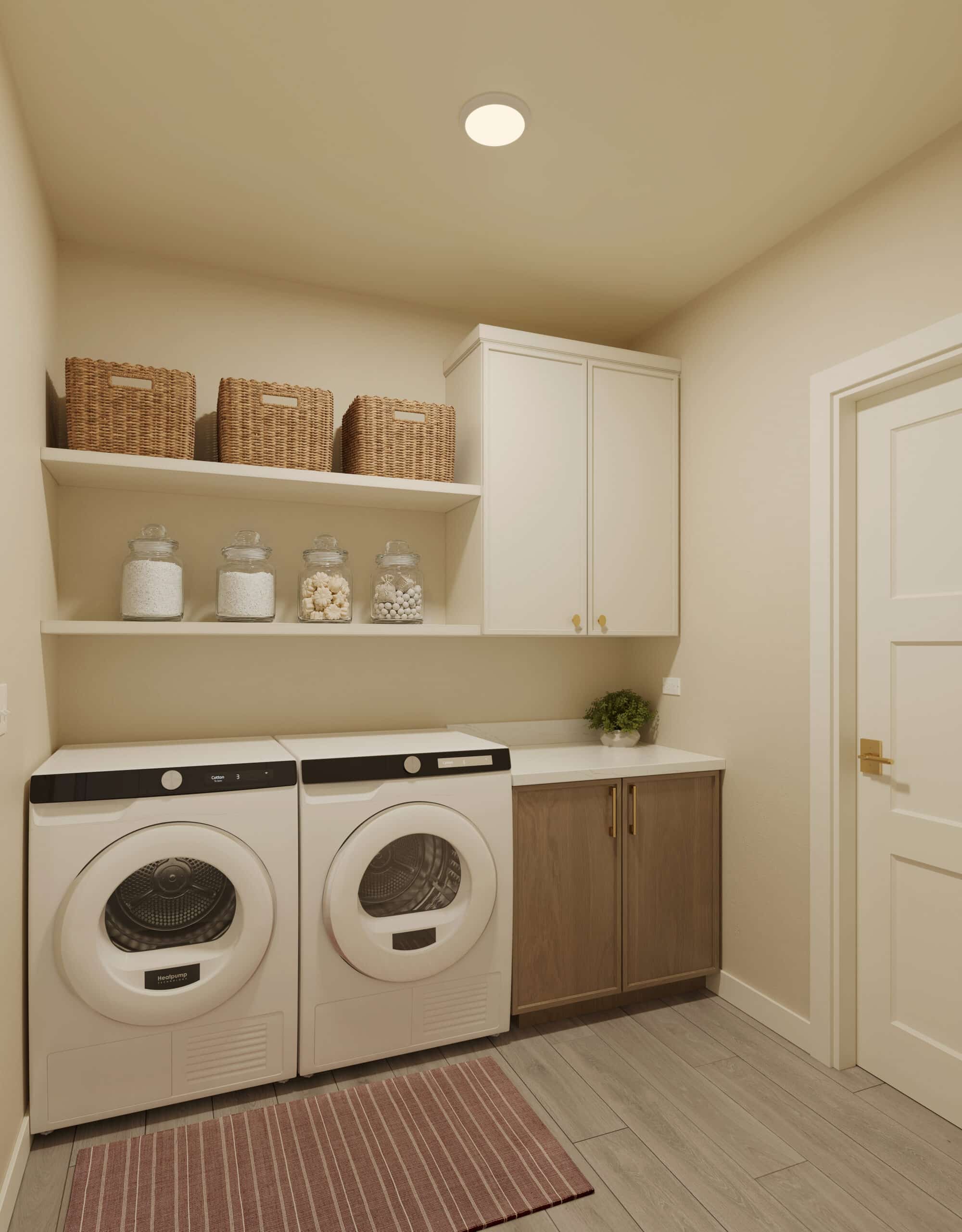 Laundry room with a washer and dryer beneath shelves holding woven baskets and glass storage jars