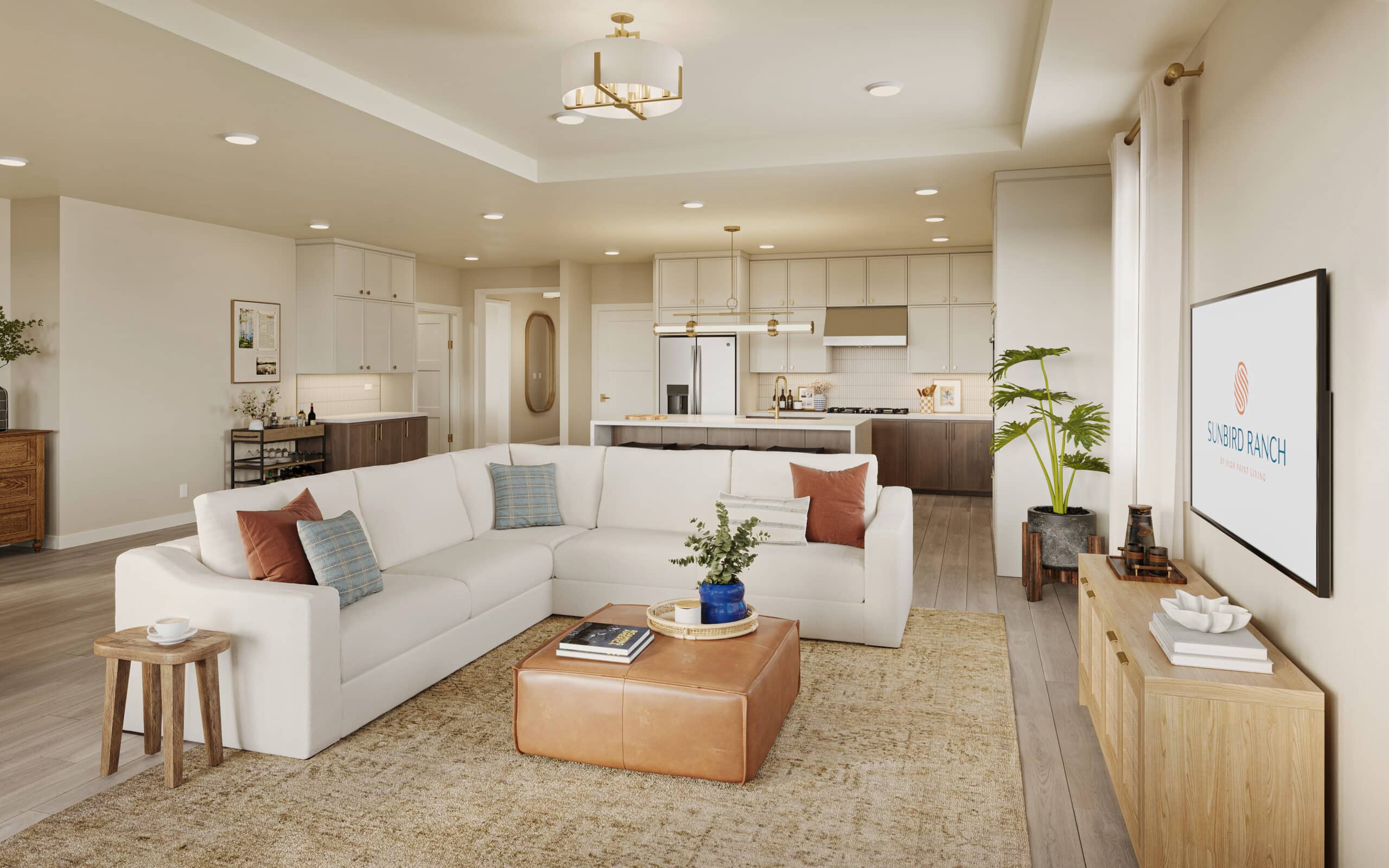 Open-plan living room and kitchen with a white sectional sofa, island, wood cabinetry, and modern decor